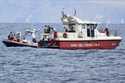 Italian Firefighters scuba divers bring ashore in a green bag the body of one of the victims of the…