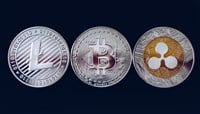 Photo of Bitcoin, litecoin and ripple coins currency finance money on graph chart background. Bitcoin as most important cryptocurrency concept. Stack of cryptocurrencies with a golden bitcoin in the middle.