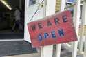 A sign hangs on the front door of Kingdom Trails in Burke, Vt