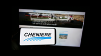 Person holding cellphone with logo of American LNG company Cheniere Energy Inc. on screen in front of business webpage